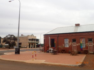 Menzies "Achievable Cafe" on the corner and the pub on the other. The cafe's optimistic improbability in this rusting backwater reminds me of A Roadside Attraction later filmed with Magdalene Sagerbruct (?) 