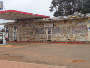 On the way out of Menzies a dead service station under a shroud of number latest, the true graffiti of the automobile