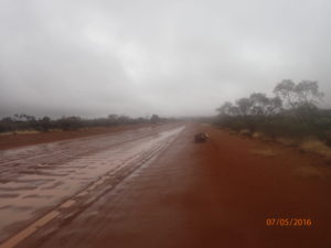Riding on the batter of the rain softened, corrugated, muddy red sand channel that is a road in this part of the Northern Territory