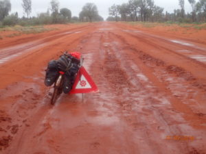 Road repair Northern Territory style; not an issue as there is still sufficient road on either side of the bog hole for vehicles to use