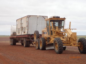 Sarah bringing the Davenport Downs grader home from working on an outstation roads. Ipod, a big hat and a happy outlook.