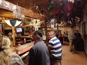 Kulgera Roadhouse bar during Happy Hour - these tourist businesses really live or die on the operator's love of people. Kulgera owner obviously likes interacting with people even if some need chasing down the highway to be reminded to pay for fuel!