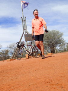 Lambert's Geographical Centre of Australia and a happy cyclist